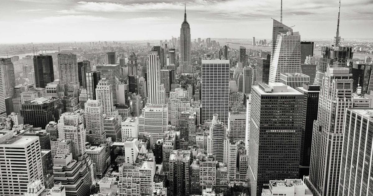 Alberta provincial flag flying above a government building in Edmonton