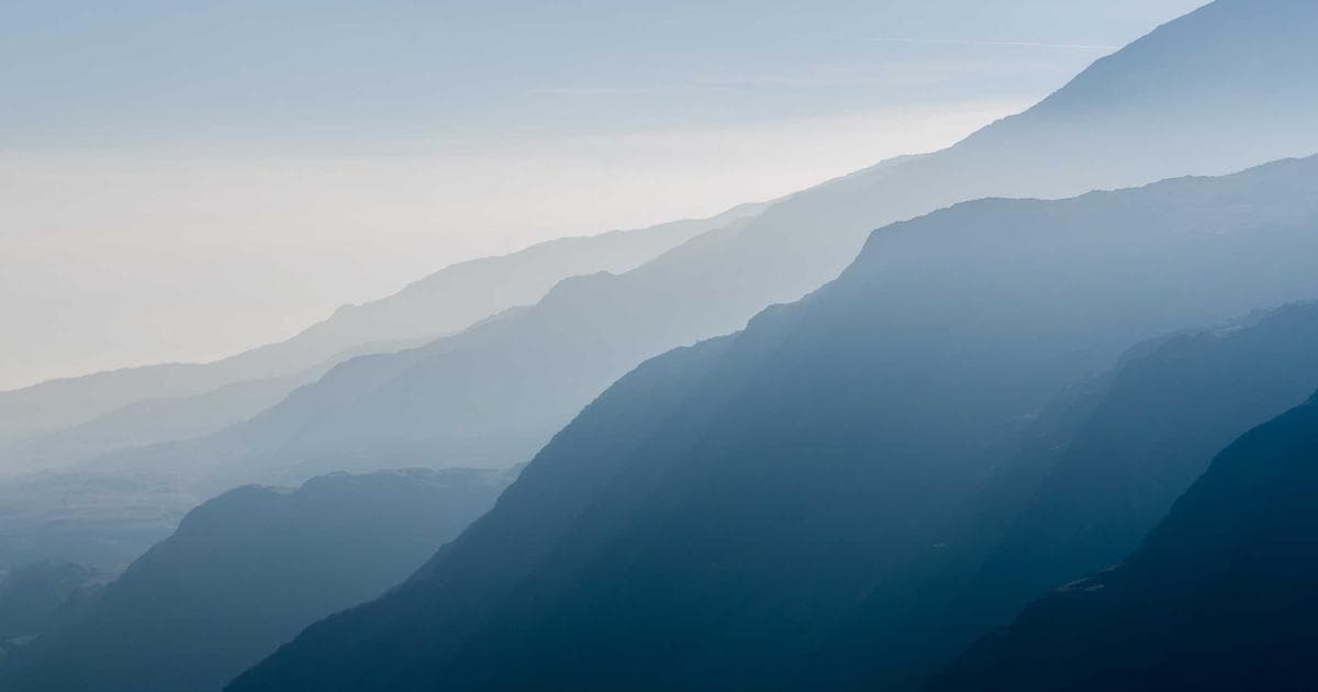 Wide view of Saskatchewan grain fields under a bright sky representing opportunities in the province