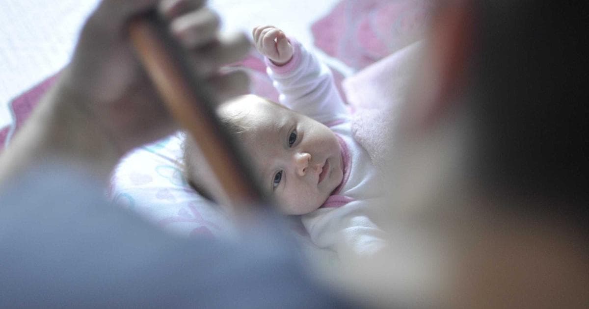 Entrepreneur shaking hands with a business partner in front of a Saskatchewan office building