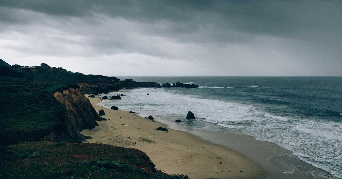 Foreign worker in Canada holding work permit documents during transition to permanent residence