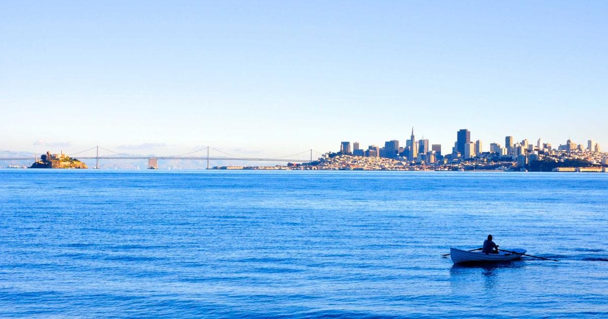A traveler completing an eTA application on their laptop before a flight to Canada