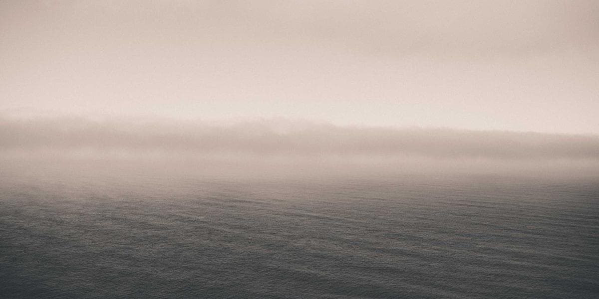 Smiling senior couple holding travel documents, symbolizing the Canadian Super Visa for parents and grandparents.