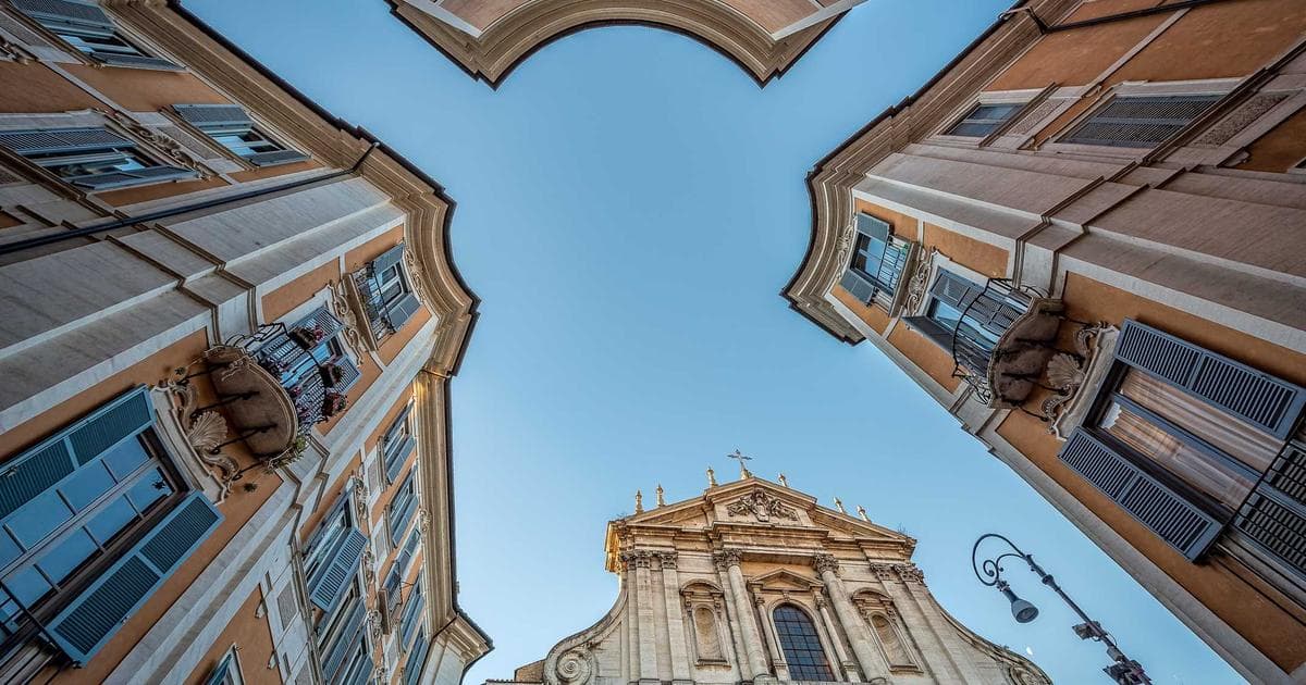 Diverse group of newcomer volunteers smiling while helping at a community project in Canada