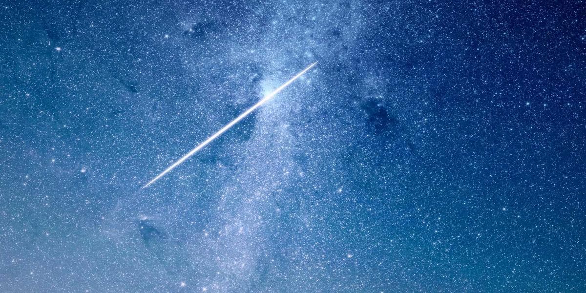 Canadian flag flying in front of a modern immigration office building representing Express Entry 2026 changes