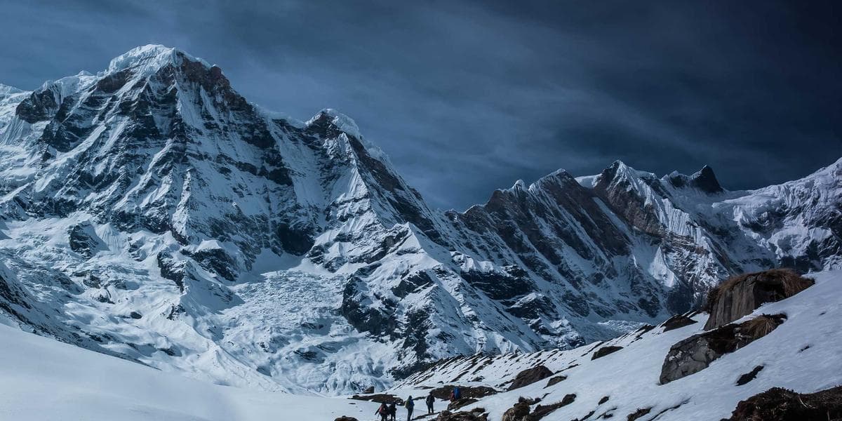 A newcomer parent and child looking at education savings options on a tablet