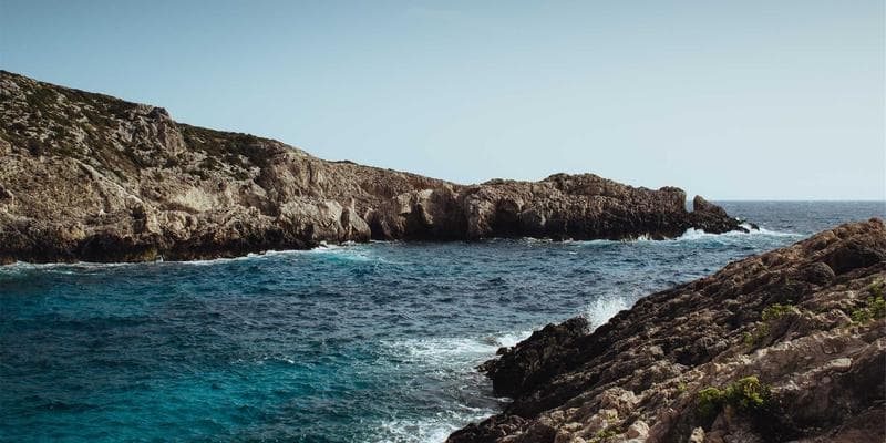 A diverse group of people smiling and looking towards the future, symbolizing families and individuals embarking on their journey to Canada, perhaps after successfully completing immigration forms.