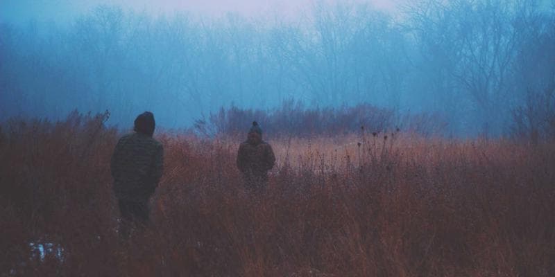 Close-up of a TD1 form with a pen and calculator, symbolizing tax preparation