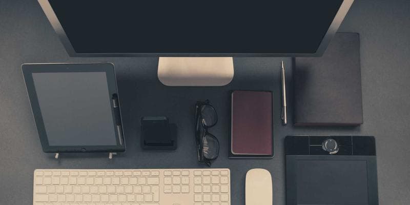 Documents spread out on a table, including a passport application form, birth certificate, and ID card