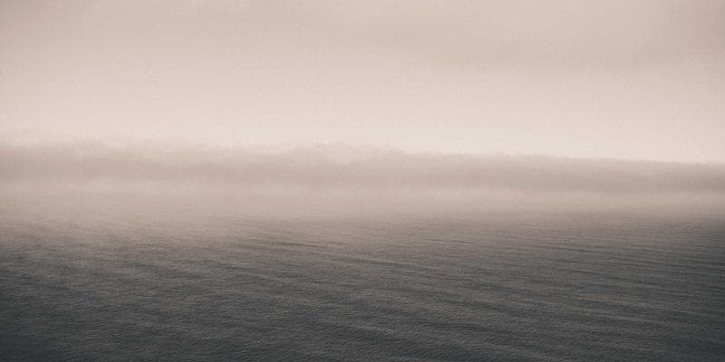 Newcomer shaking hands with a Canadian employer in a bright, modern office setting