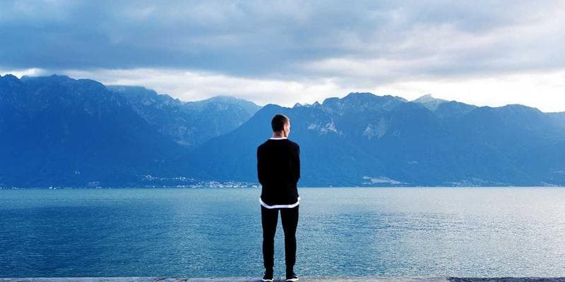 Caregiver assisting an elderly person, representing home support