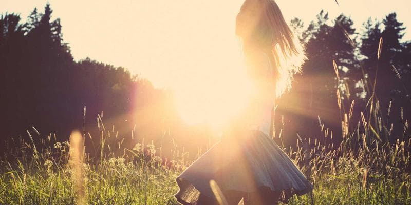 A person reviewing documents with a checklist, emphasizing careful review