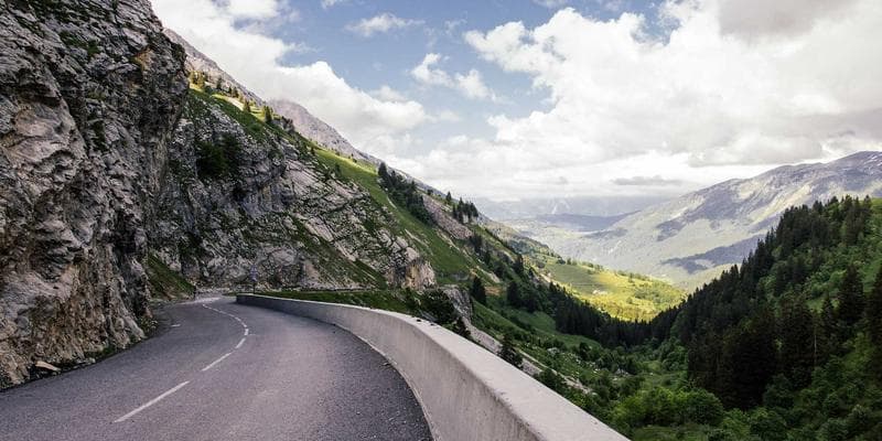 Family embracing warmly in a sunlit park, symbolizing successful family reunification in Canada