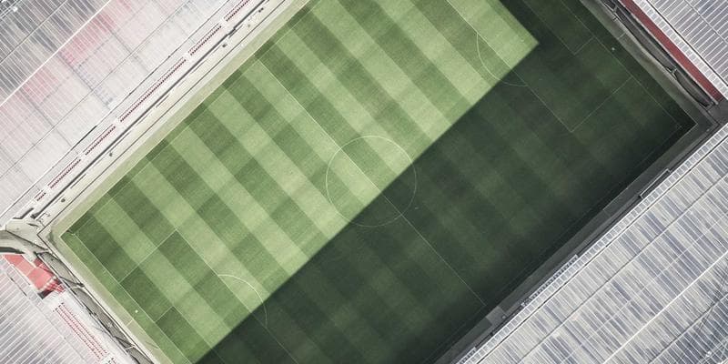 Two people sitting on a bench, one comforting the other, symbolizing support and empathy