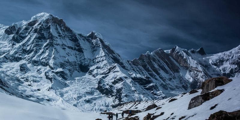 A person looking thoughtfully at a computer screen, representing the careful consideration needed for an H&C application.