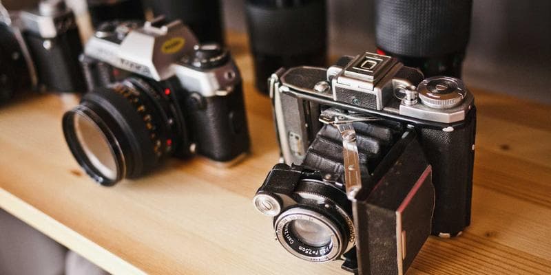 Person meticulously checking documents and forms with a pen