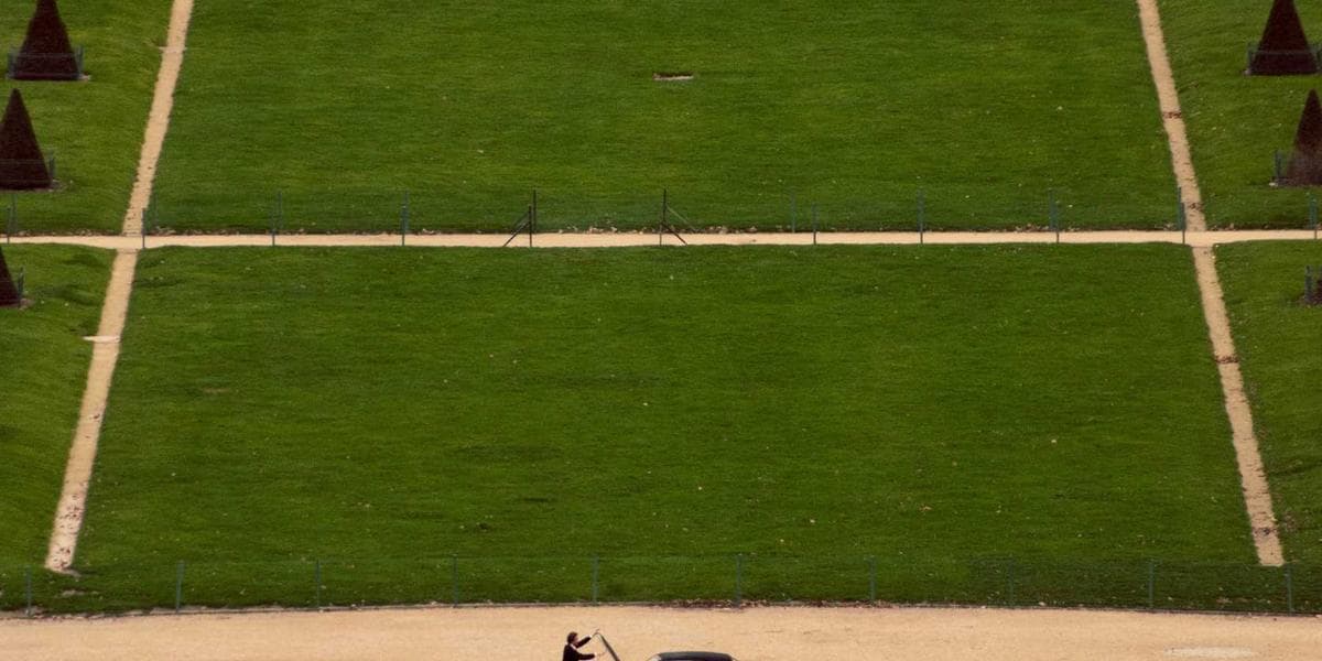 An HVAC technician servicing a heating and cooling system on a Canadian rooftop