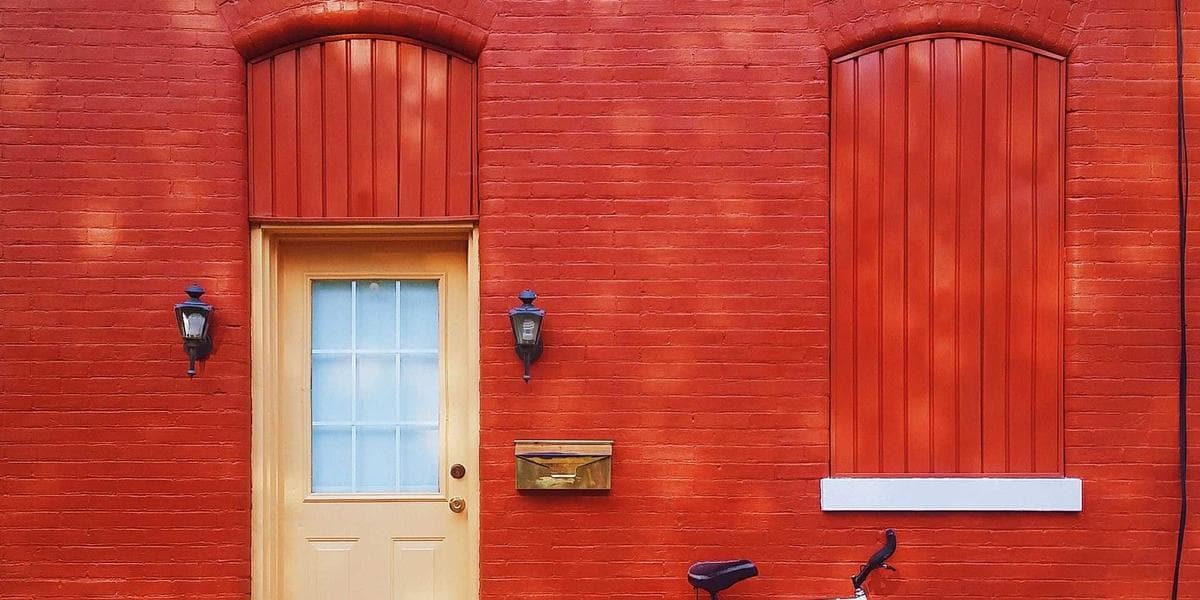 A welder in protective gear working on metal fabrication in a Canadian industrial facility
