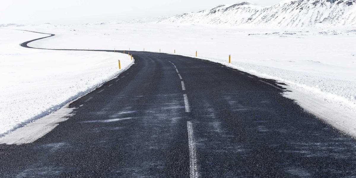 A paralegal reviewing legal documents at a desk in a Canadian law office