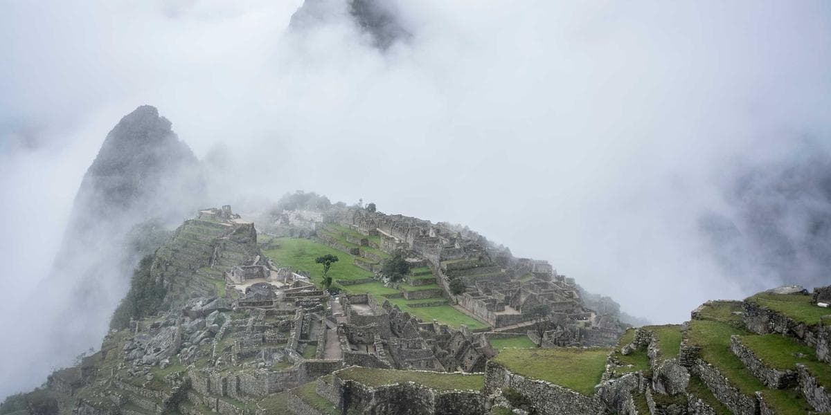 A respiratory therapist assisting a patient with breathing treatment in a Canadian hospital