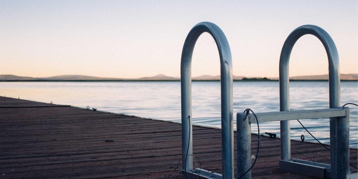 A speech-language pathologist working with a child on communication exercises in a Canadian clinic