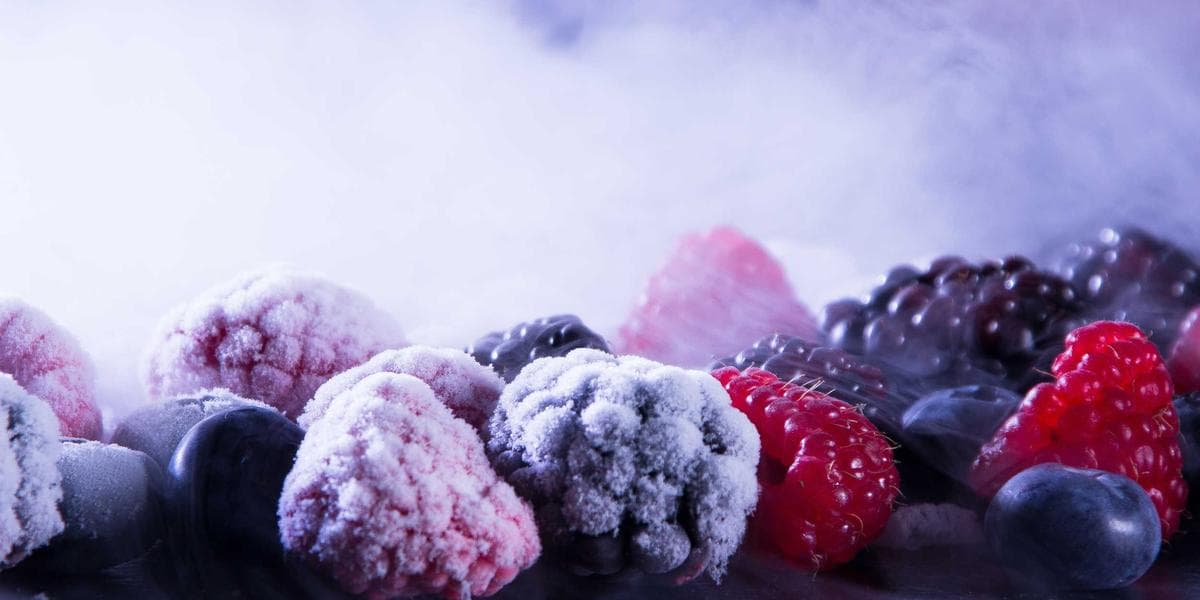 Newcomer comparing Canadian bank options at branch with advisor helping