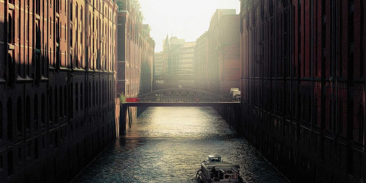 Car-sharing vehicle on street with app showing booking interface