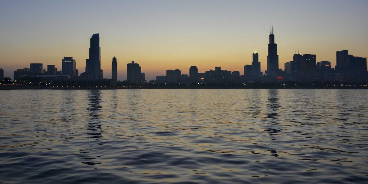 Settlement worker helping refugee claimants with paperwork