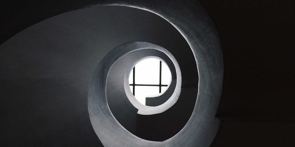 Agricultural workers in a Canadian greenhouse harvesting vegetables