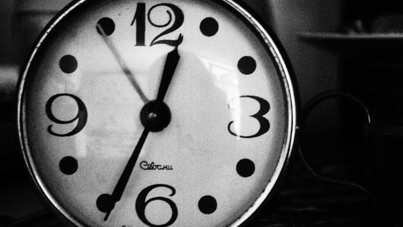 Canadian currency and a calculator on a table representing financial benefits