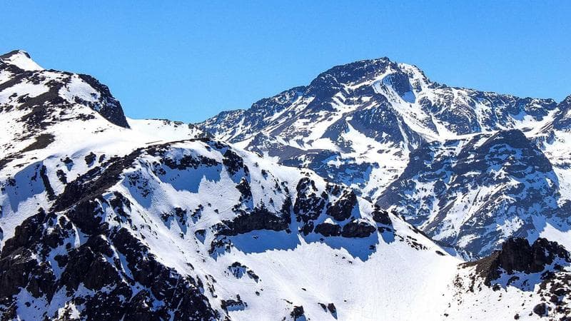 A family reviewing financial documents together at a kitchen table