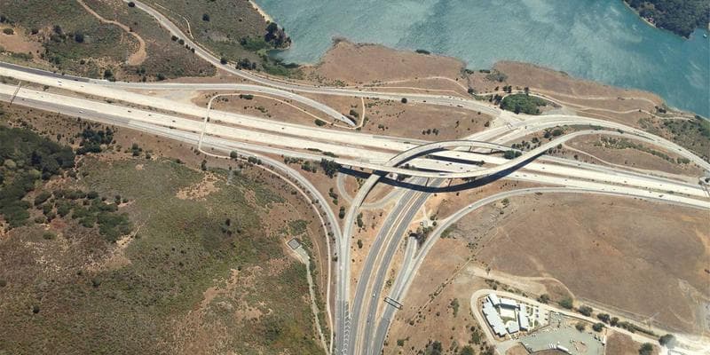 Business owner reviewing training grant application on computer