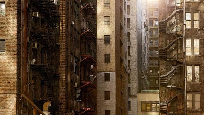 Construction workers reviewing blueprints at a Canadian building site