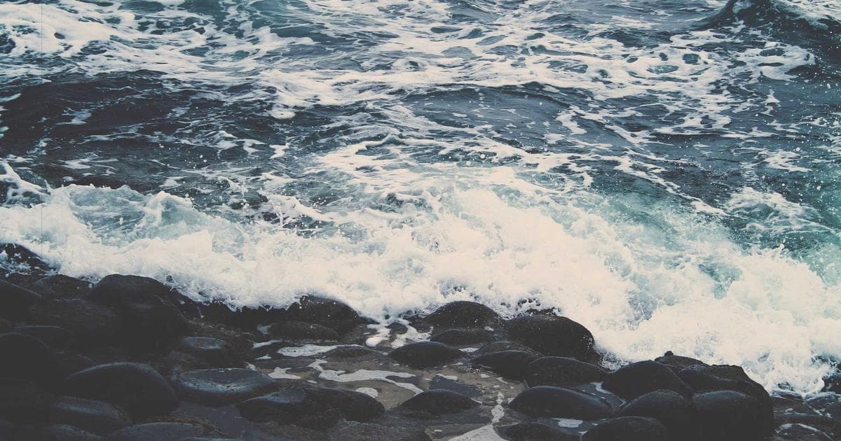 Travel document and boarding pass on a table with a map in the background