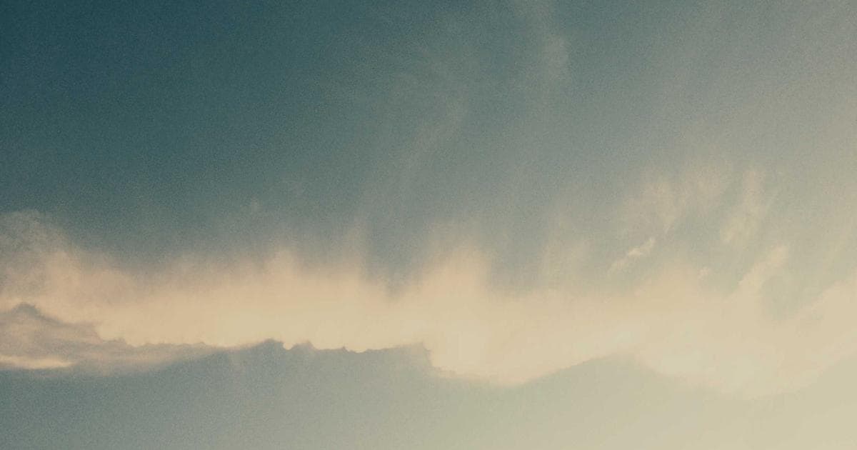 Graduate in cap and gown holding a diploma at a Canadian university convocation
