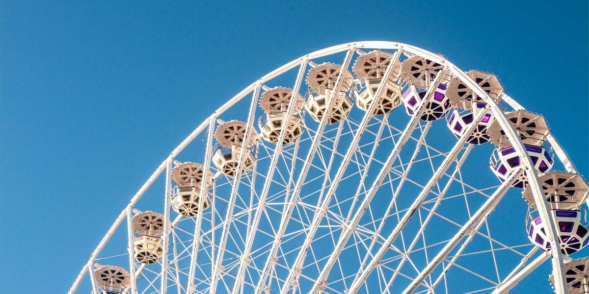 International student studying at a Canadian university library with textbooks and laptop