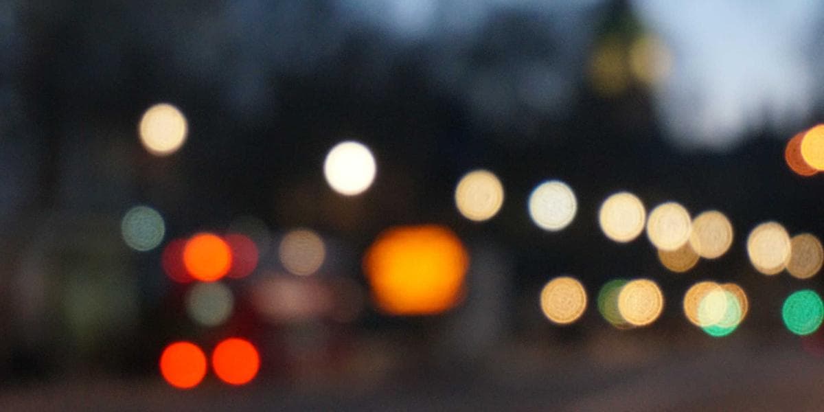 Newcomer working on a laptop at home managing their side business in the evening