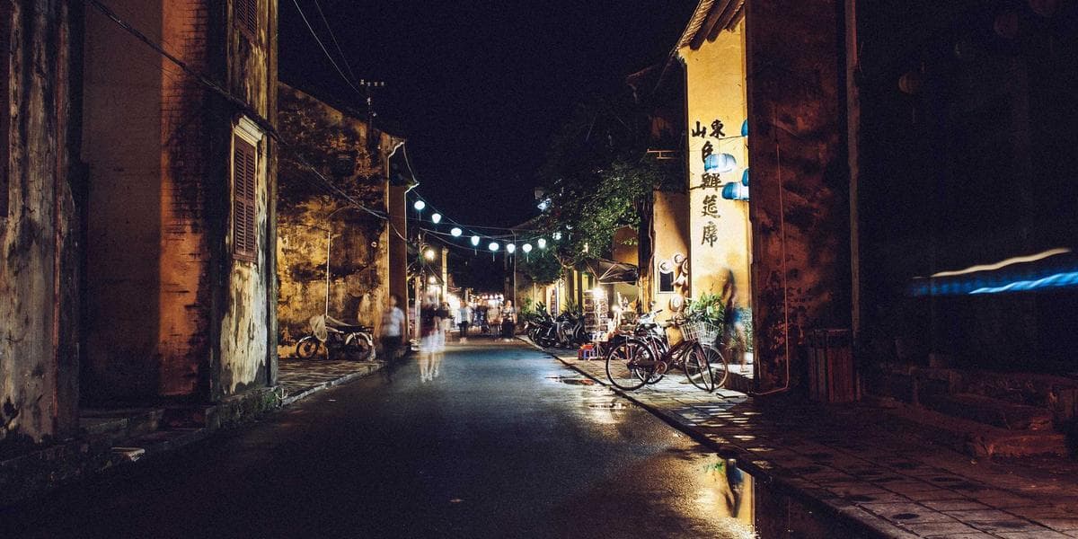 Diverse group reviewing a contract document with magnifying glass symbolizing consumer protection