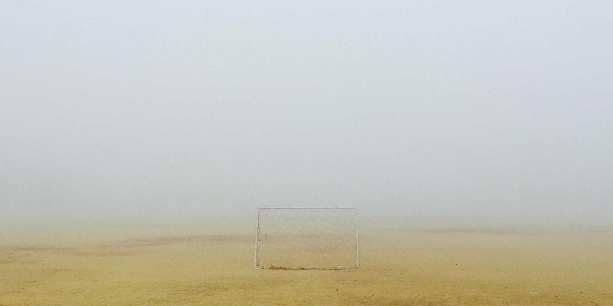 Business owner reviewing incorporation documents at a desk with Canadian flag in the background