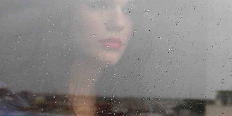 Shared apartment kitchen with roommates preparing meals together