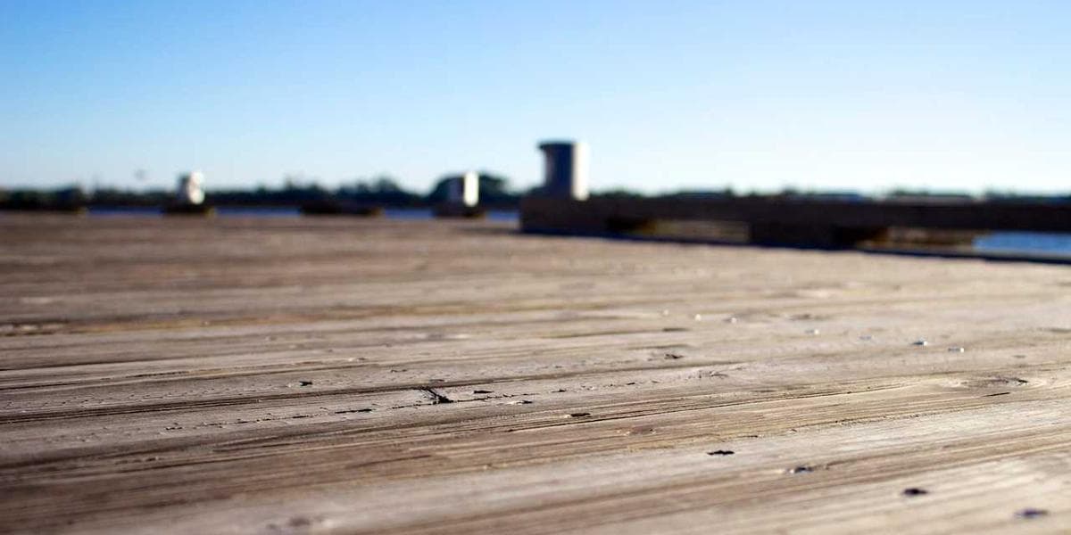 Furnished short-term rental apartment with suitcases near the door, representing newcomer temporary housing