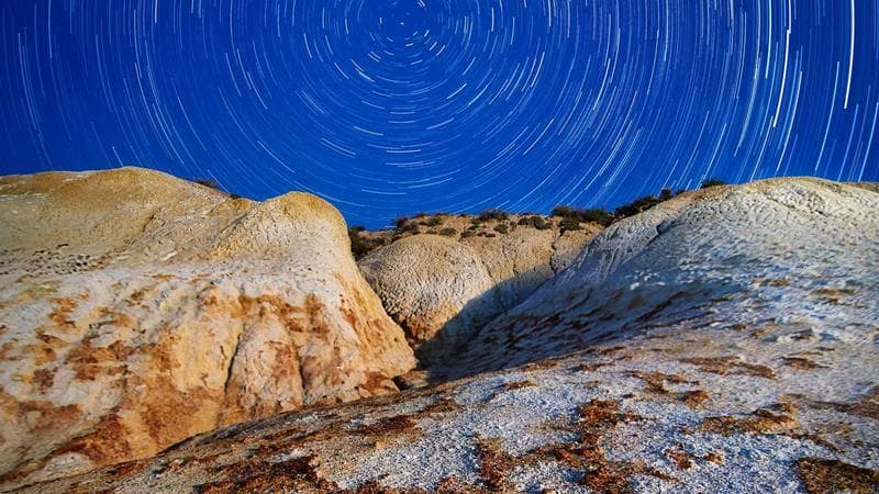 Professional caregiver assisting a senior in a bright and comfortable Canadian living room