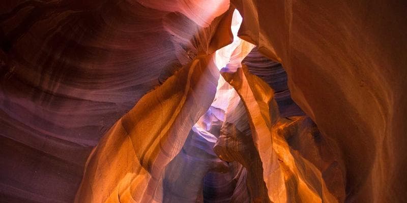 Provincial health cards from different Canadian provinces displayed on a table