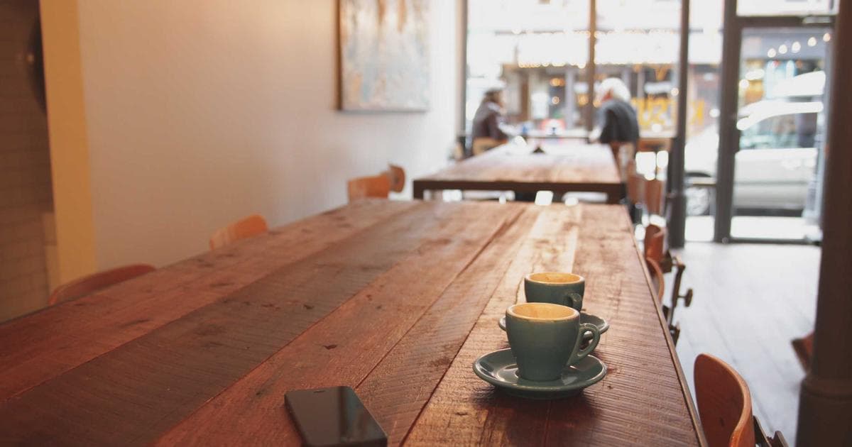 Scenic view of a Vancouver neighborhood with mountains and water, highlighting urban living for newcomers.