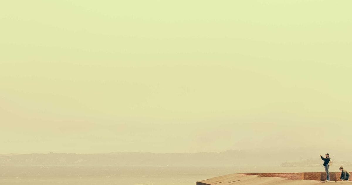 IELTS and CELPIP test papers side-by-side, with a Canadian flag, representing language tests for immigration.