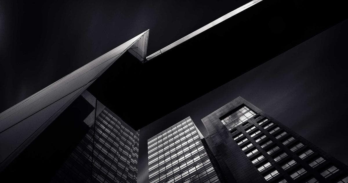 Senior couple smiling, with icons for CPP, OAS, and GIS, representing Canada's retirement system for immigrants.