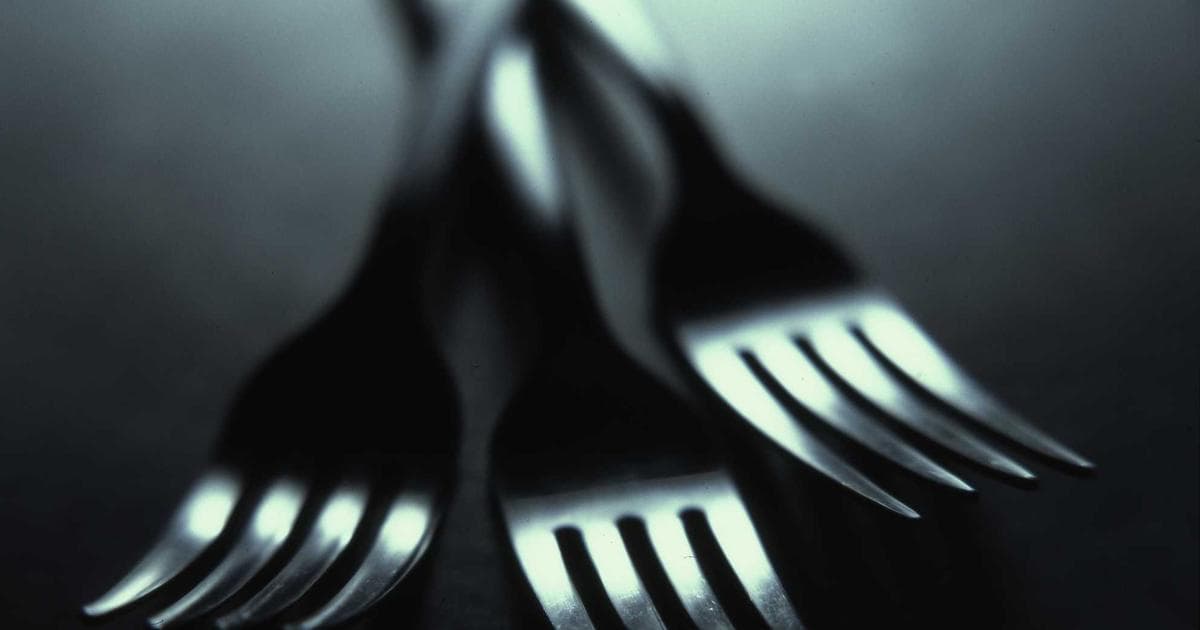 Shopping cart full of diverse groceries in a Canadian supermarket aisle, symbolizing grocery shopping tips.