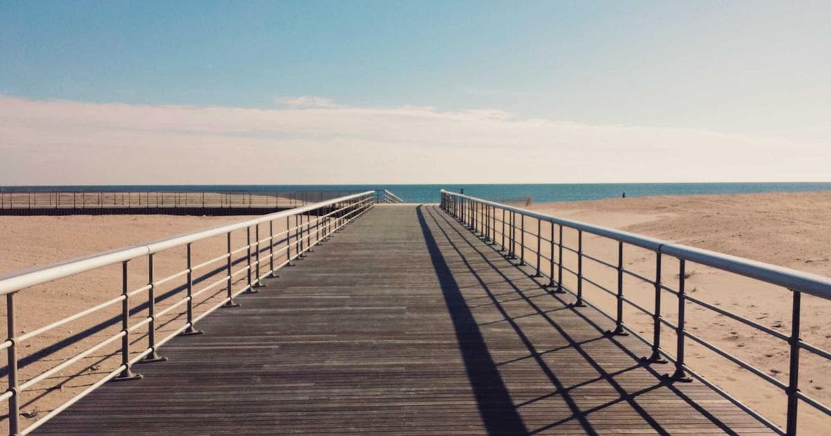 A newcomer reviewing Canadian tax forms and documents, preparing to file their first tax return with guidance.