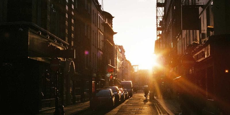 Parent with children reviewing Canada Child Benefit information on laptop