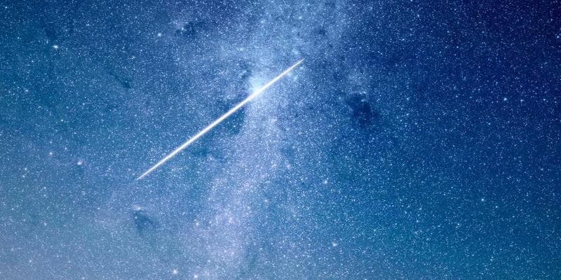 Stack of corporate tax documents with financial statements and calculator