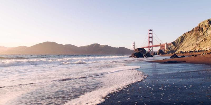 Newcomer reviewing official tax paperwork and checklists at a desk